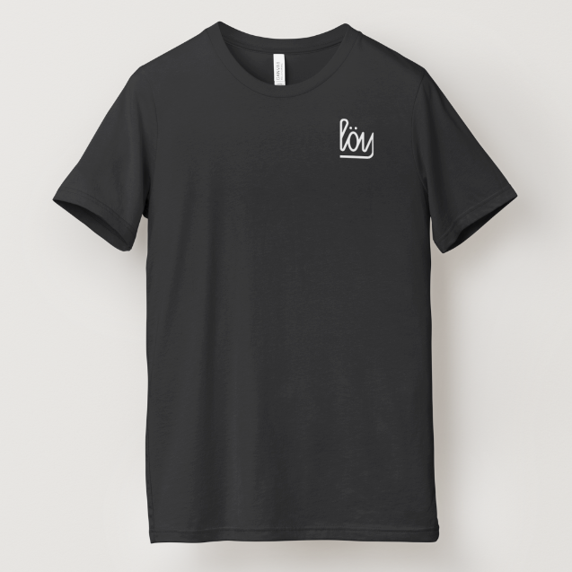 A black short-sleeve crewneck t-shirt with a small white script logo on the left chest, displayed against a light gray background.