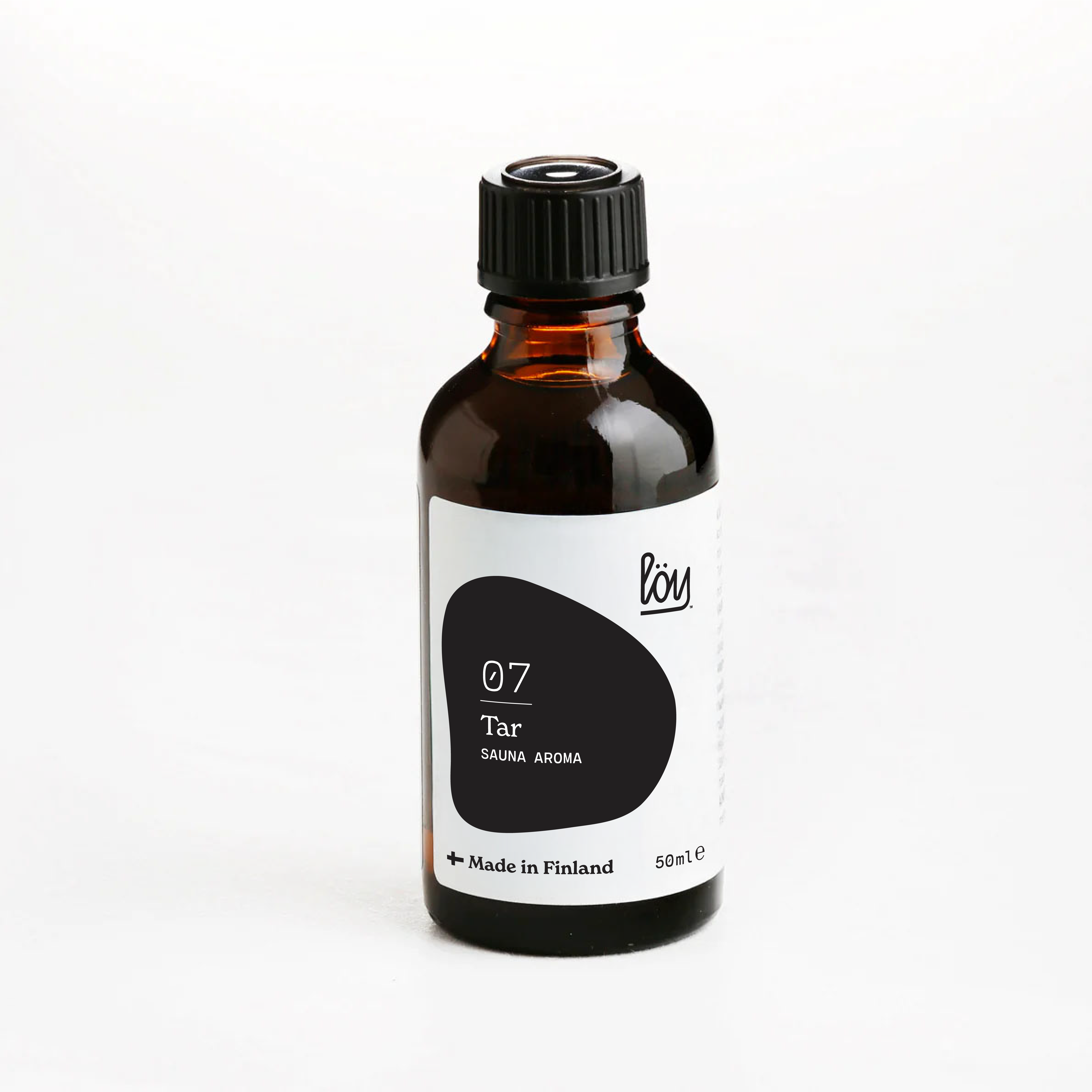 Bottle of 'Tar' sauna aroma with a black cap on a white background