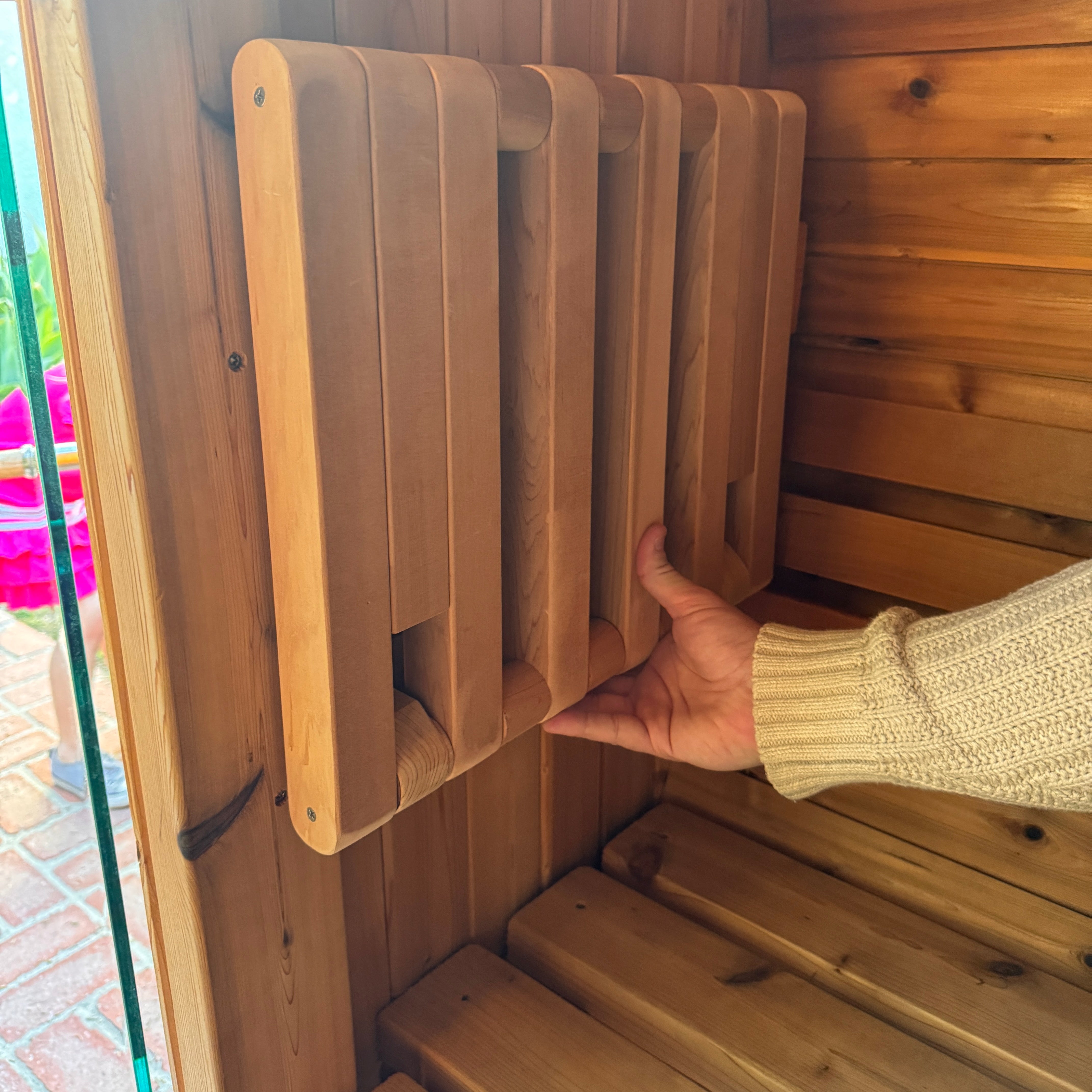 Loy sauna seat folded up against the wall